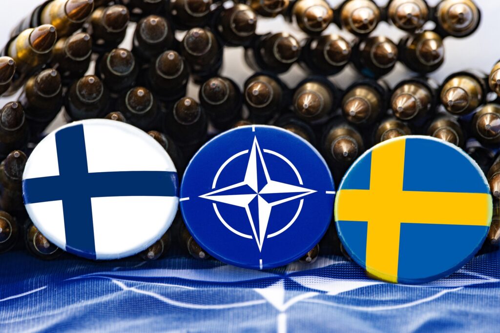 Image by Marek Studzinski from Pixabay (https://pixabay.com/photos/flag-sweden-nato-cross-yellow-red-7222491/)